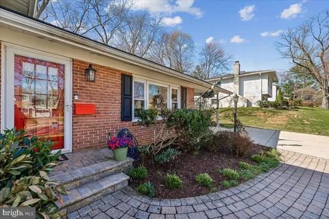 a view of wooden floor and windows in a room