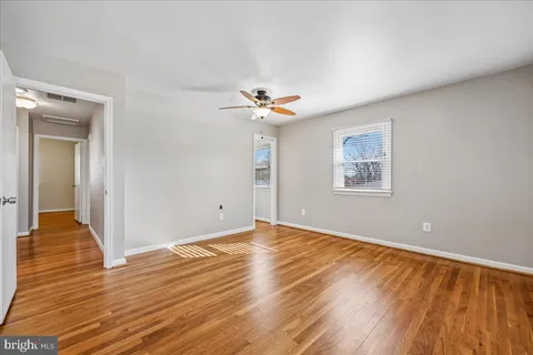 a view of an empty room with stairs