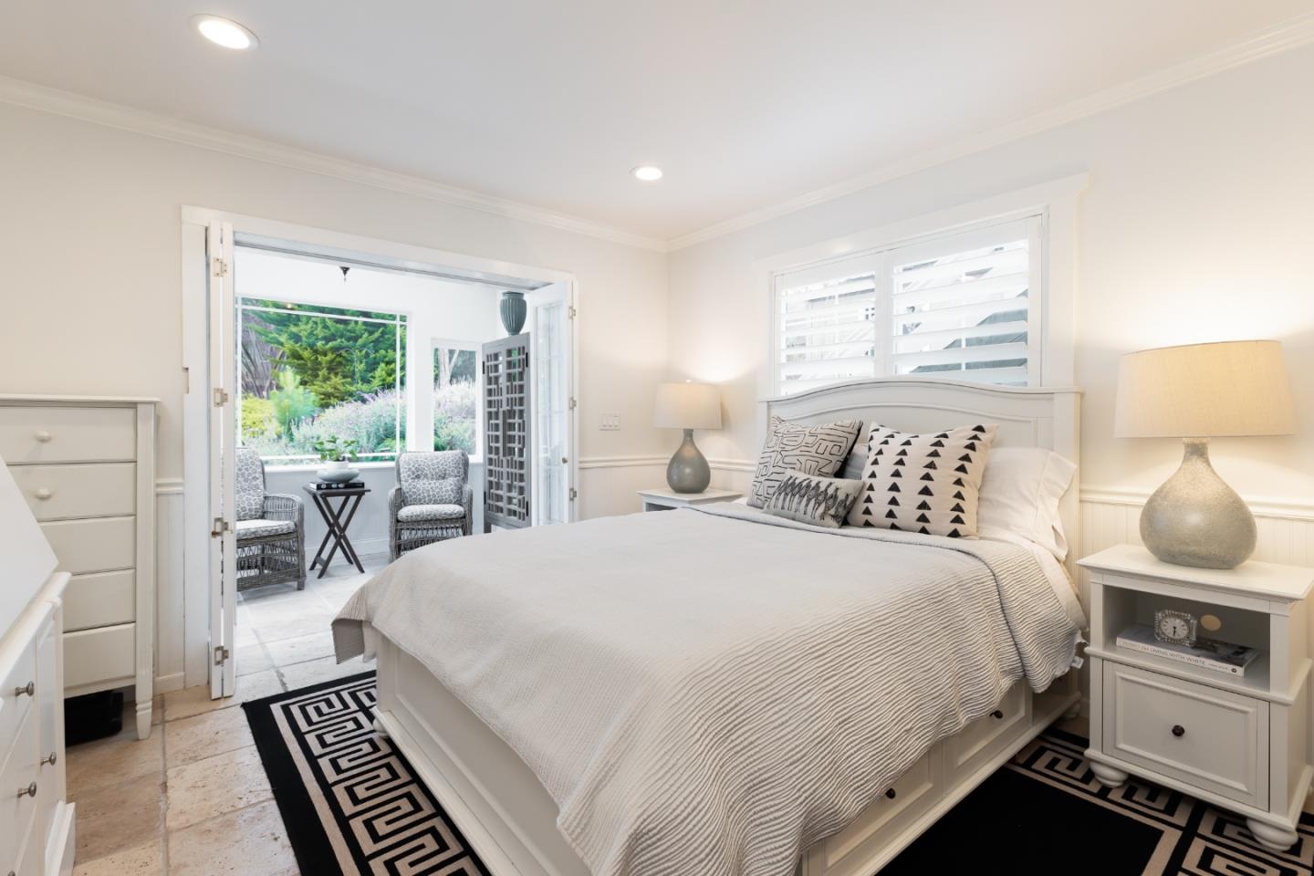 4106 Crest Road Pebble Beach, CA 93953 - Photo 13 of 43 a bed room with a bed and a chair