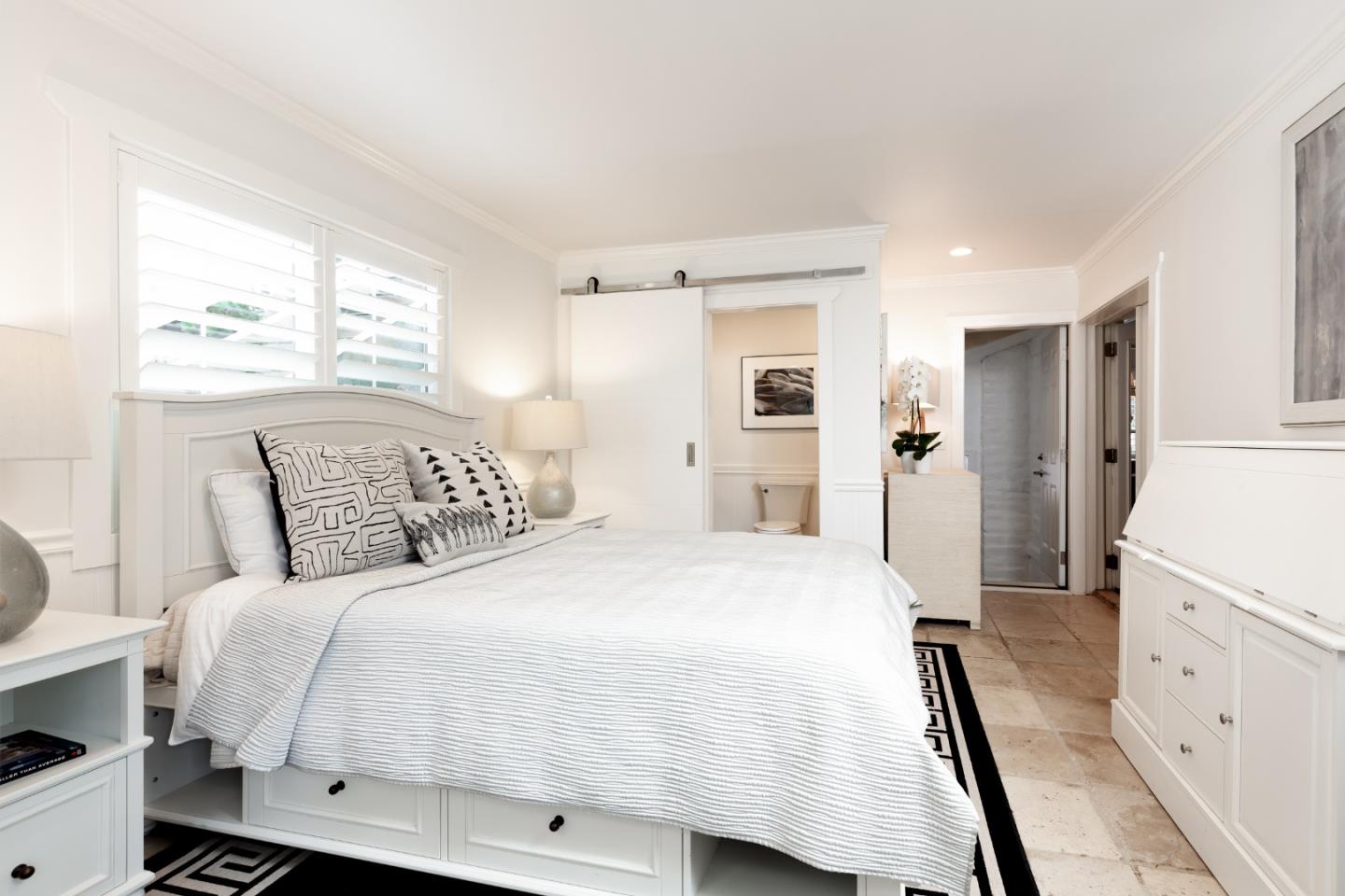 4106 Crest Road Pebble Beach, CA 93953 - Photo 14 of 43 a bedroom with a bed and a refrigerator