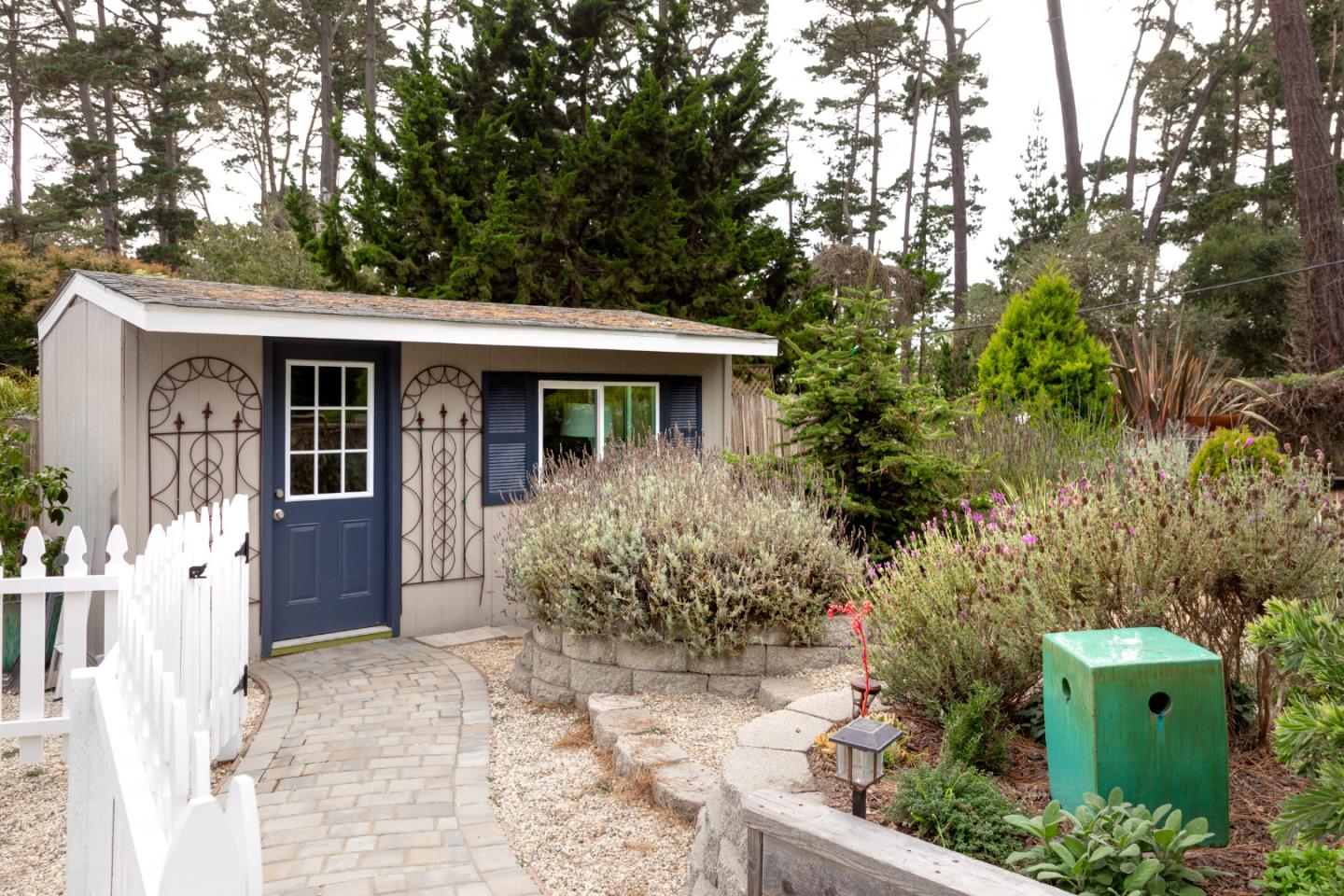 4106 Crest Road Pebble Beach, CA 93953 - Photo 26 of 43 a front view of a house with garden