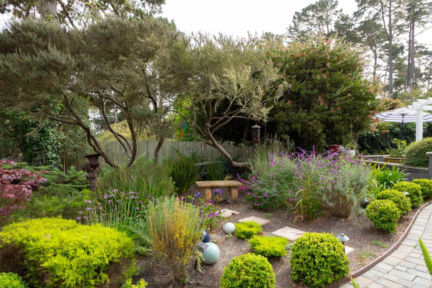 4106 Crest Road Pebble Beach, CA 93953 - Photo 29 of 43 a backyard of a house with lots of green space and garden