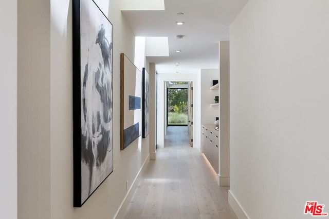 a view of a hallway with a living room