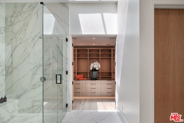 a view of a glass door and a living room