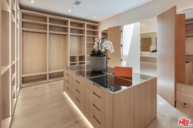 a kitchen with stainless steel appliances kitchen island granite countertop a cabinets and a sink
