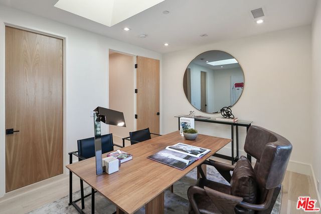 a view of a workspace with furniture