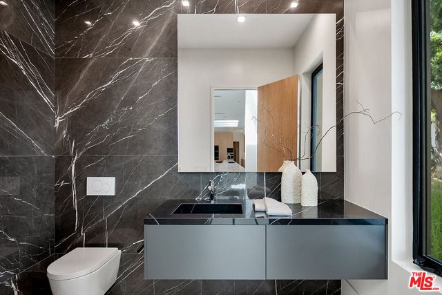 a bathroom with a sink and a toilet