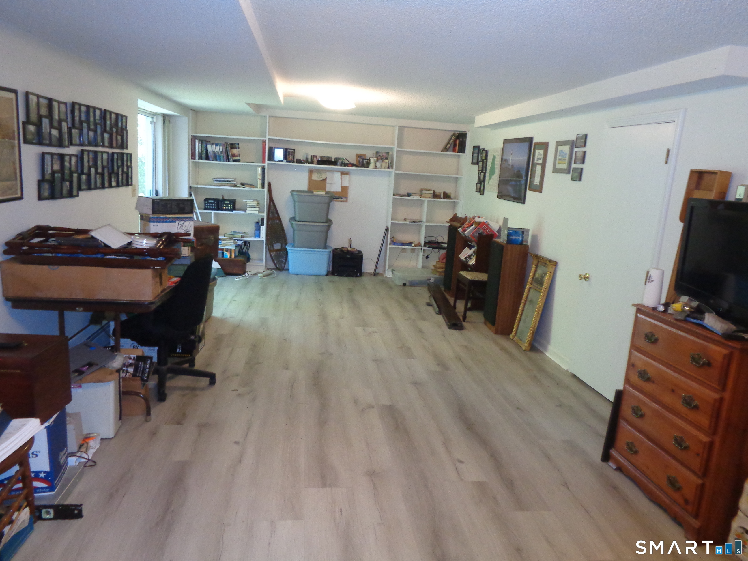 321 Spring Street Naugatuck, CT 06770 - Photo 23 of 27 a living room with furniture and a flat screen tv