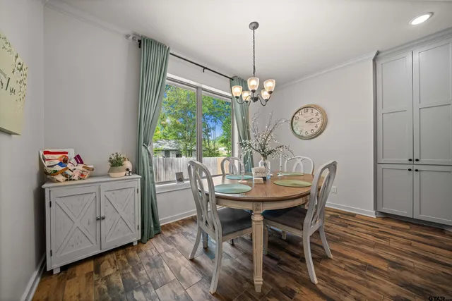 a view of a dining room and a wooden floor