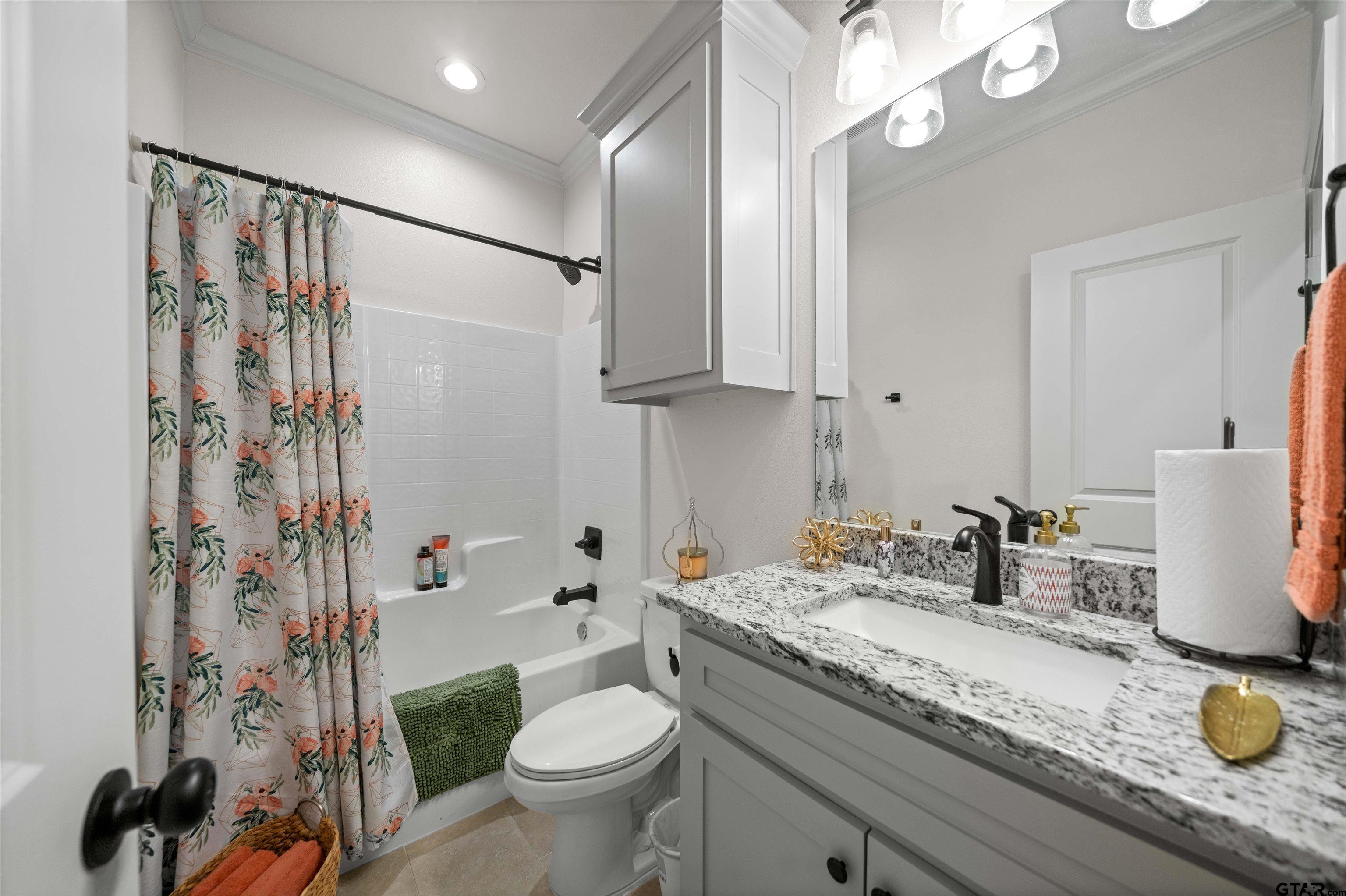 107 Rose Row Lane Winona, TX 75792 - Photo 25 of 33 a bathroom with a granite countertop sink toilet and shower