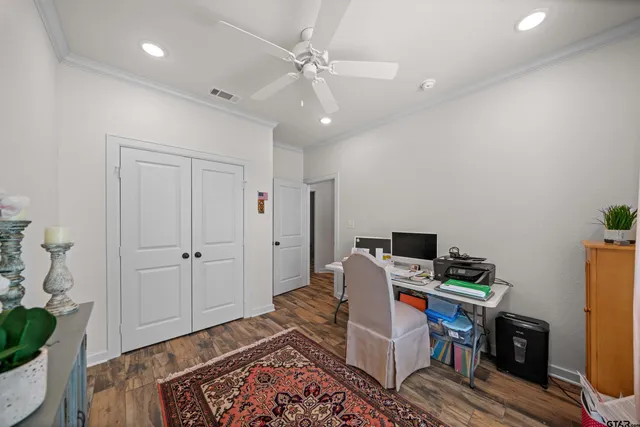 a workspace with furniture and wooden floor