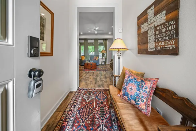 a living room with furniture and a rug