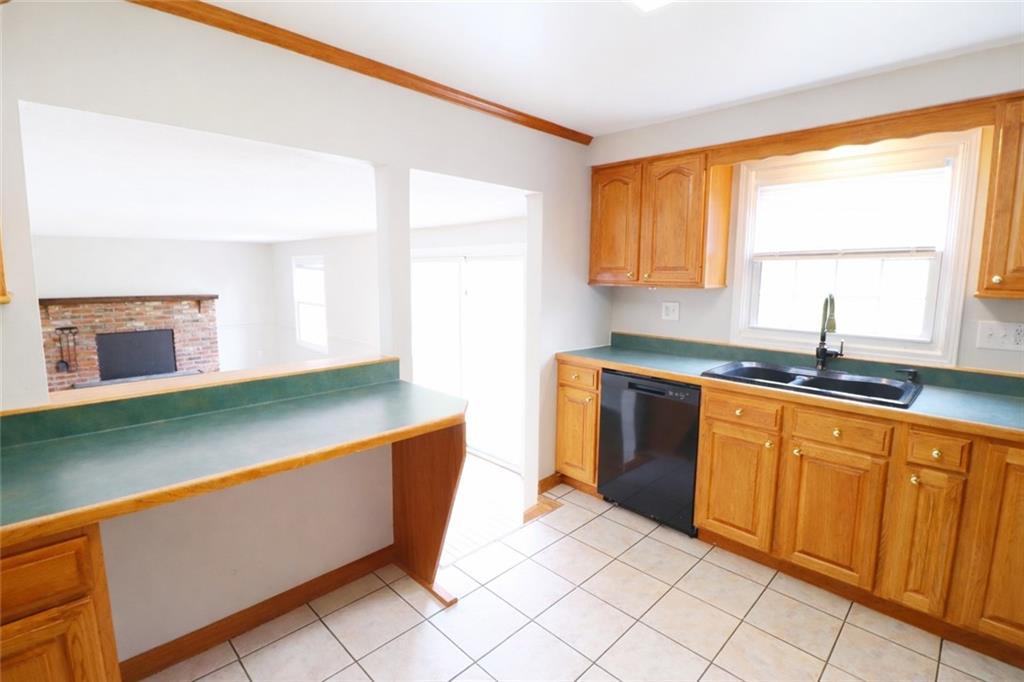 164 Friar Lane McMurray, PA 15317 - Photo 13 of 46 a kitchen with stainless steel appliances granite countertop a sink and a microwave