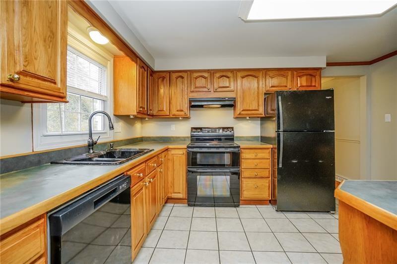 164 Friar Lane McMurray, PA 15317 - Photo 14 of 46 a kitchen with stainless steel appliances granite countertop a refrigerator and a sink