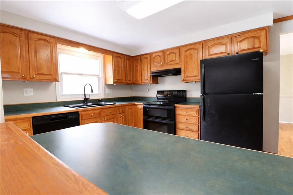 164 Friar Lane McMurray, PA 15317 - Photo 16 of 46 a kitchen with granite countertop a refrigerator stove top oven and sink