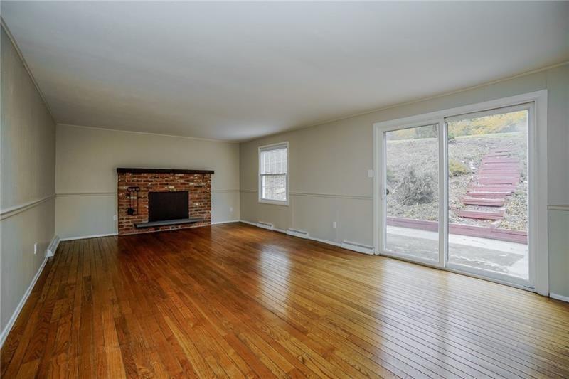 164 Friar Lane McMurray, PA 15317 - Photo 18 of 46 an empty room with wooden floor fireplace and windows