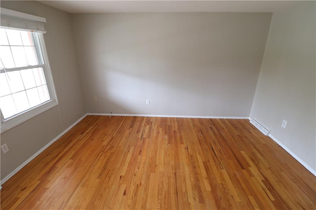 164 Friar Lane McMurray, PA 15317 - Photo 23 of 46 an empty room with wooden floor and windows