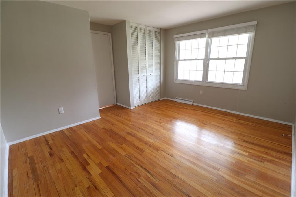 164 Friar Lane McMurray, PA 15317 - Photo 24 of 46 a view of an empty room with wooden floor and a window