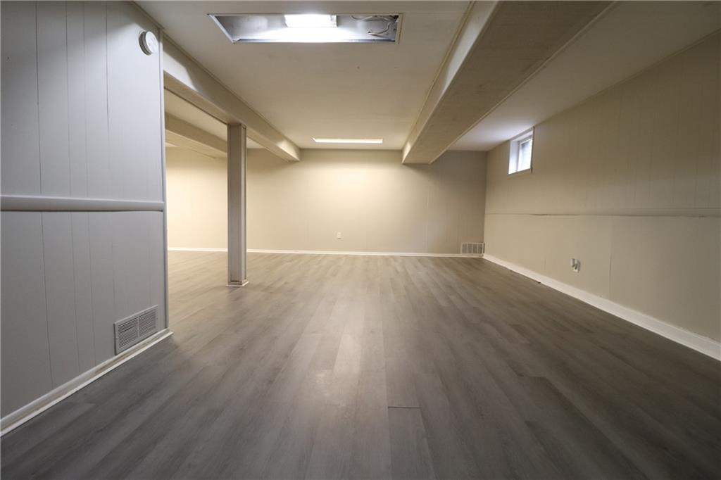 164 Friar Lane McMurray, PA 15317 - Photo 38 of 46 an empty room with wooden floor and windows