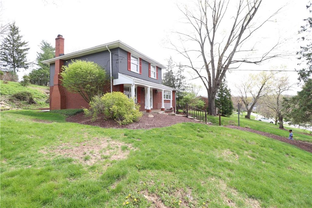 164 Friar Lane McMurray, PA 15317 - Photo 45 of 46 a brick house with trees in front of it