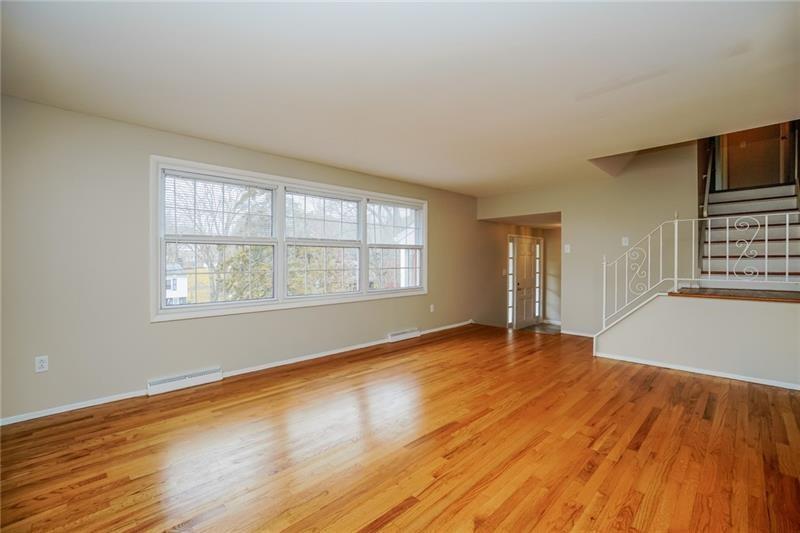 164 Friar Lane McMurray, PA 15317 - Photo 8 of 46 an empty room with wooden floor and windows