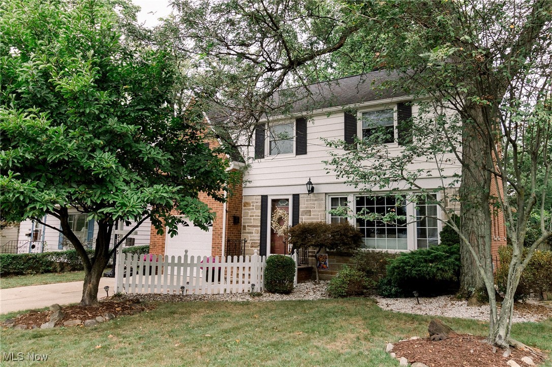 5275 Spencer Road Cleveland, OH 44124 - Photo 15 of 38 Colonial house featuring a garage and a front lawn