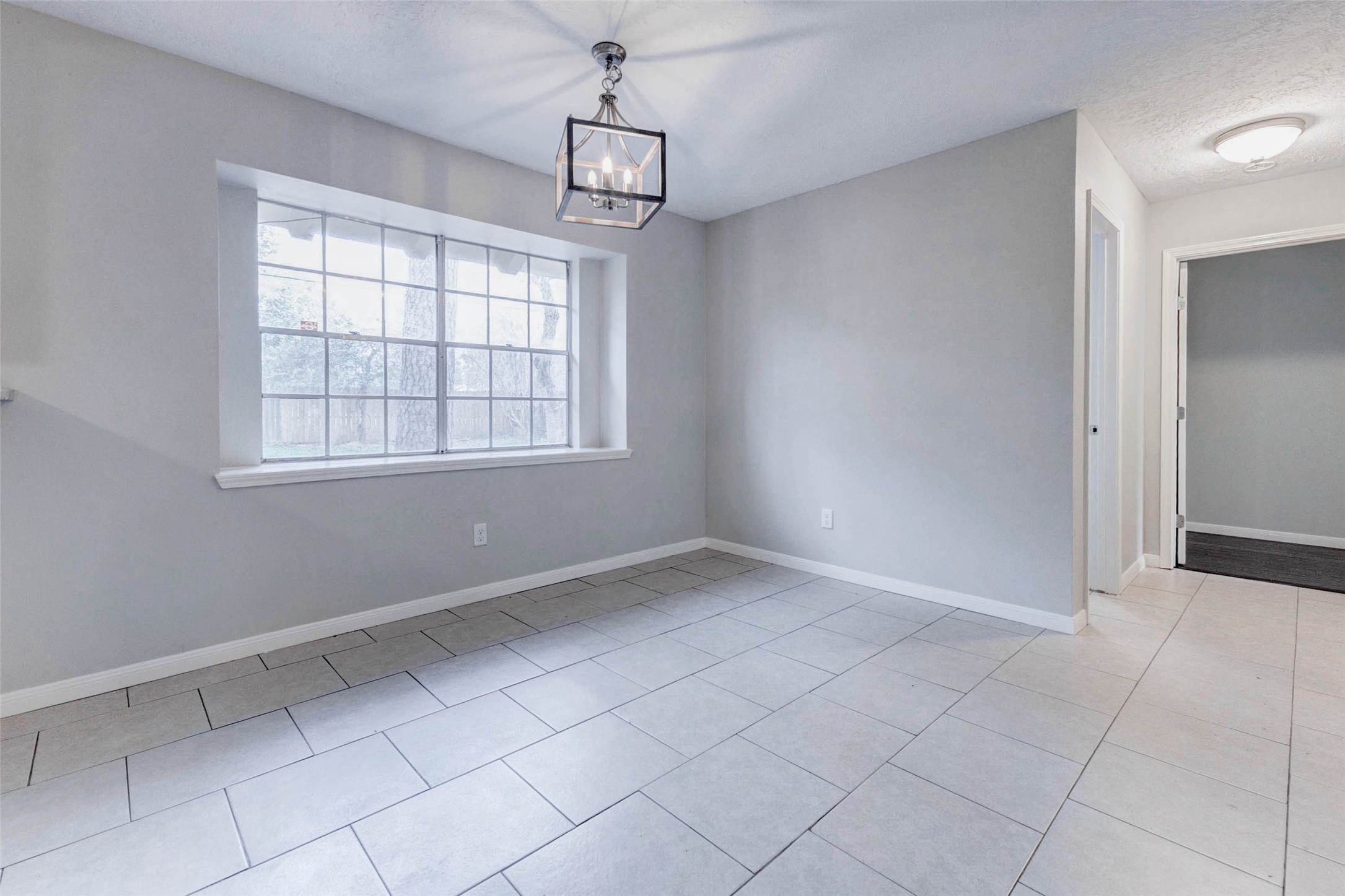 1622 Elk River Road Houston, TX 77090 - Photo 17 of 40 a view of an empty room with a window
