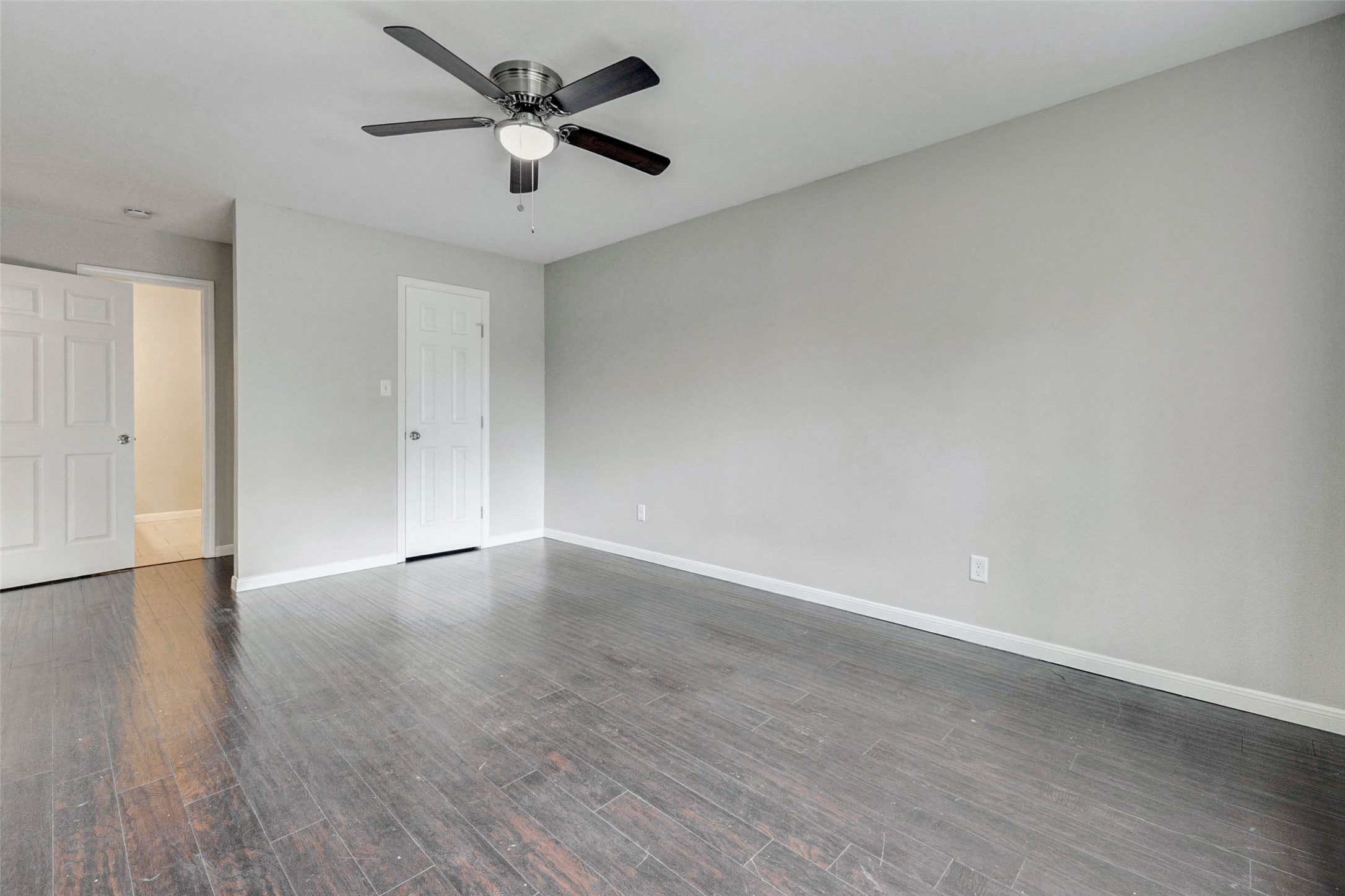 1622 Elk River Road Houston, TX 77090 - Photo 21 of 40 a view of an empty room and wooden floor