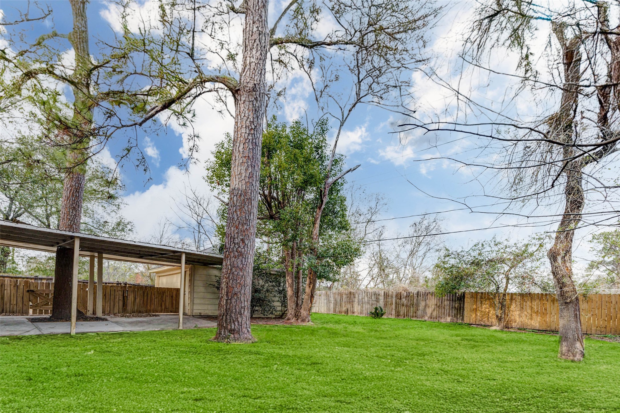 1622 Elk River Road Houston, TX 77090 - Photo 38 of 40 a view of a house with a yard