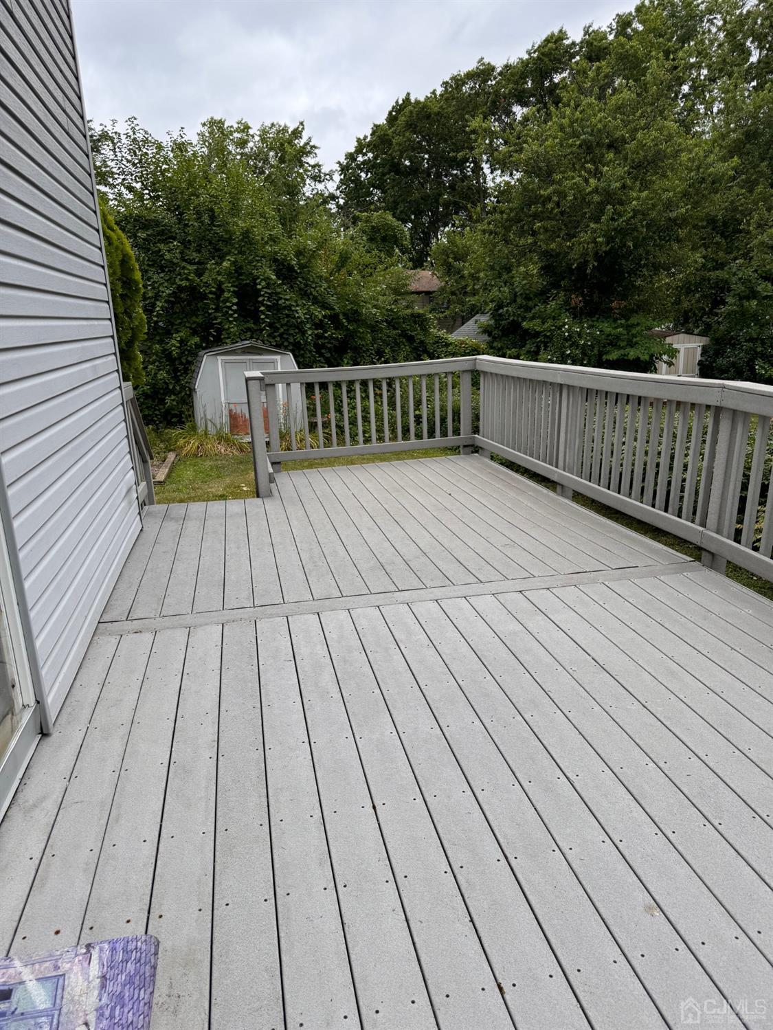155 Jefferson Boulevard Edison, NJ 08817 - Photo 17 of 21 a view of deck with wooden floor and seating space