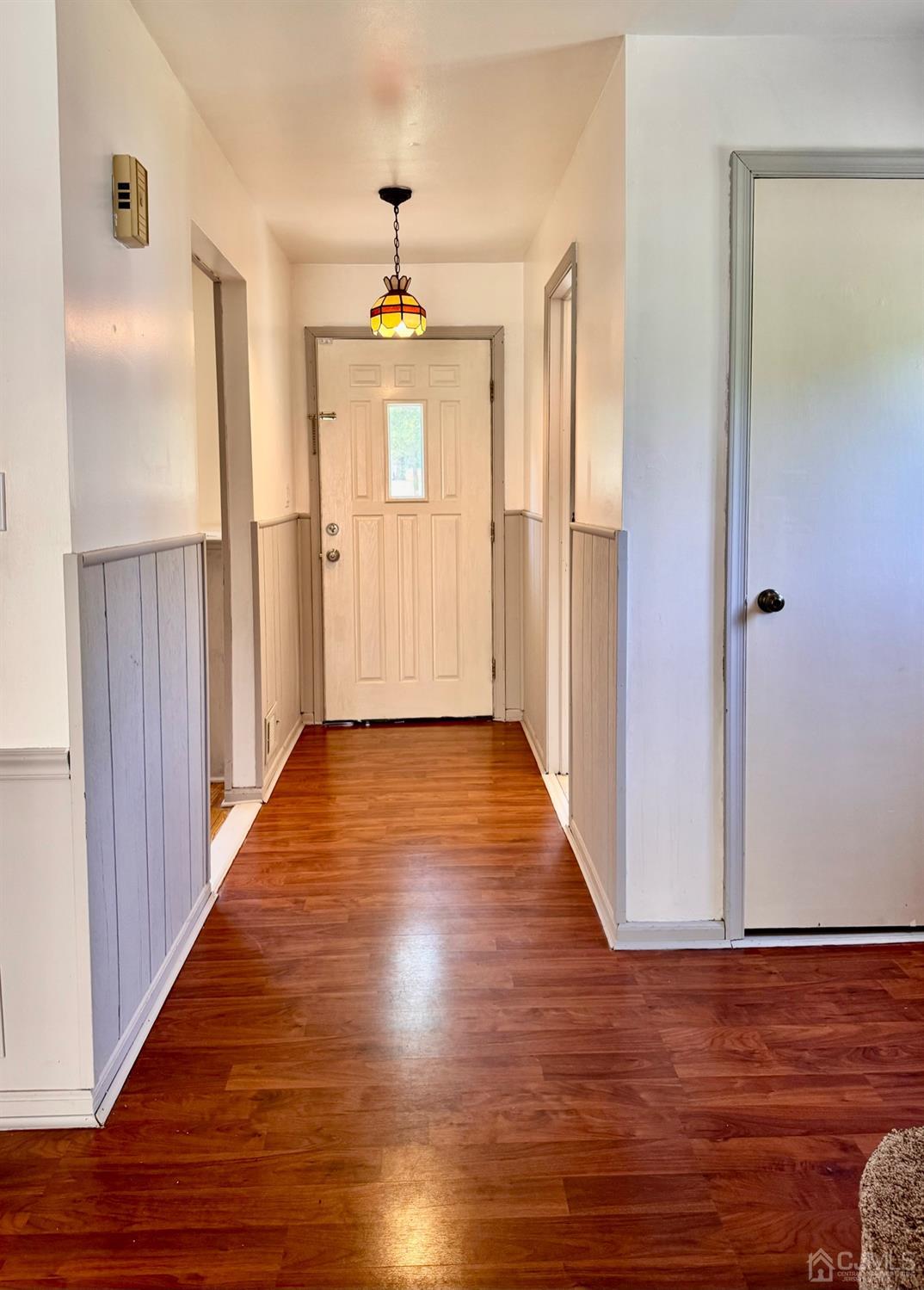 155 Jefferson Boulevard Edison, NJ 08817 - Photo 3 of 21 a view of a hallway with wooden floor and staircase