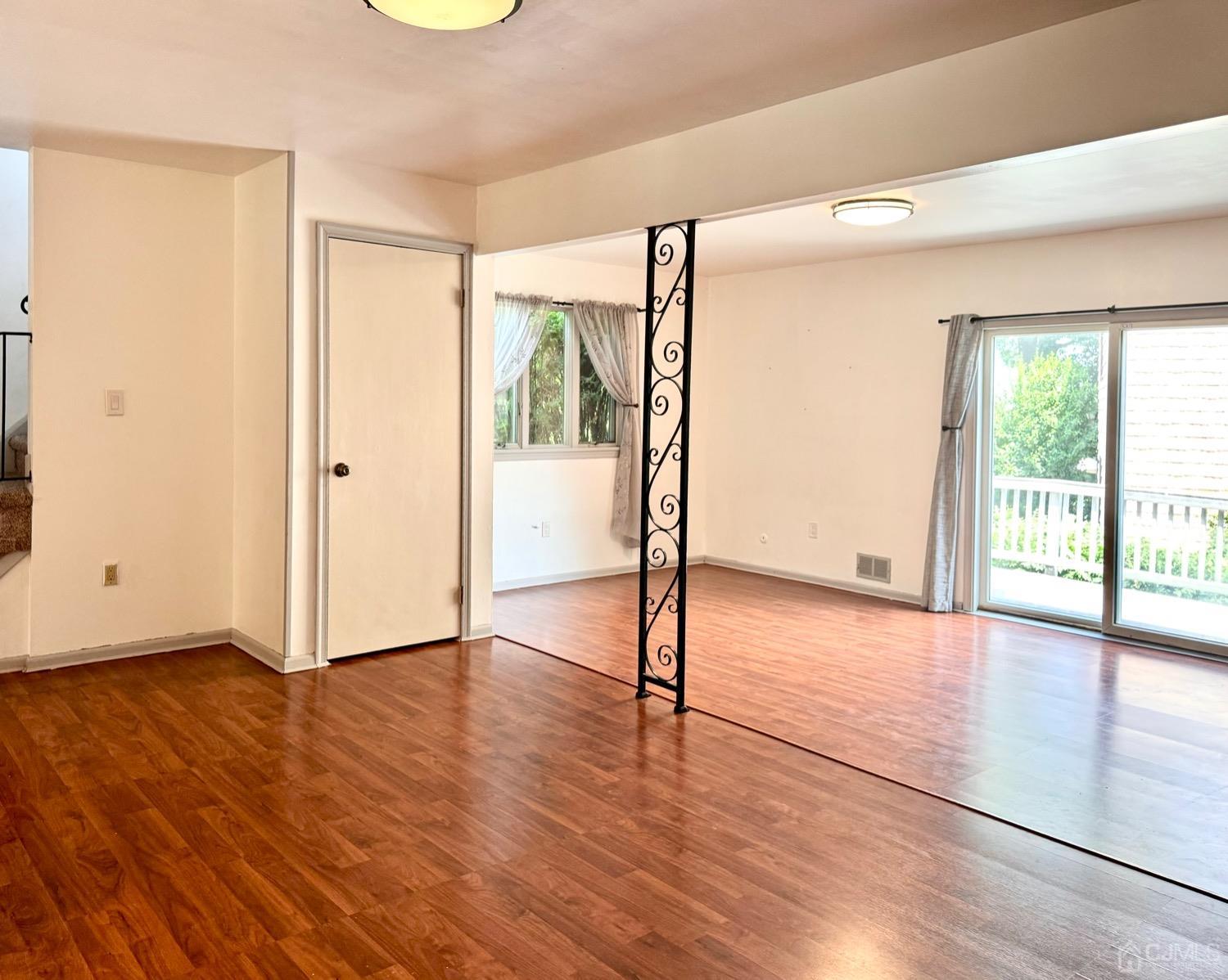 155 Jefferson Boulevard Edison, NJ 08817 - Photo 5 of 21 a view of an empty room with wooden floor and a window