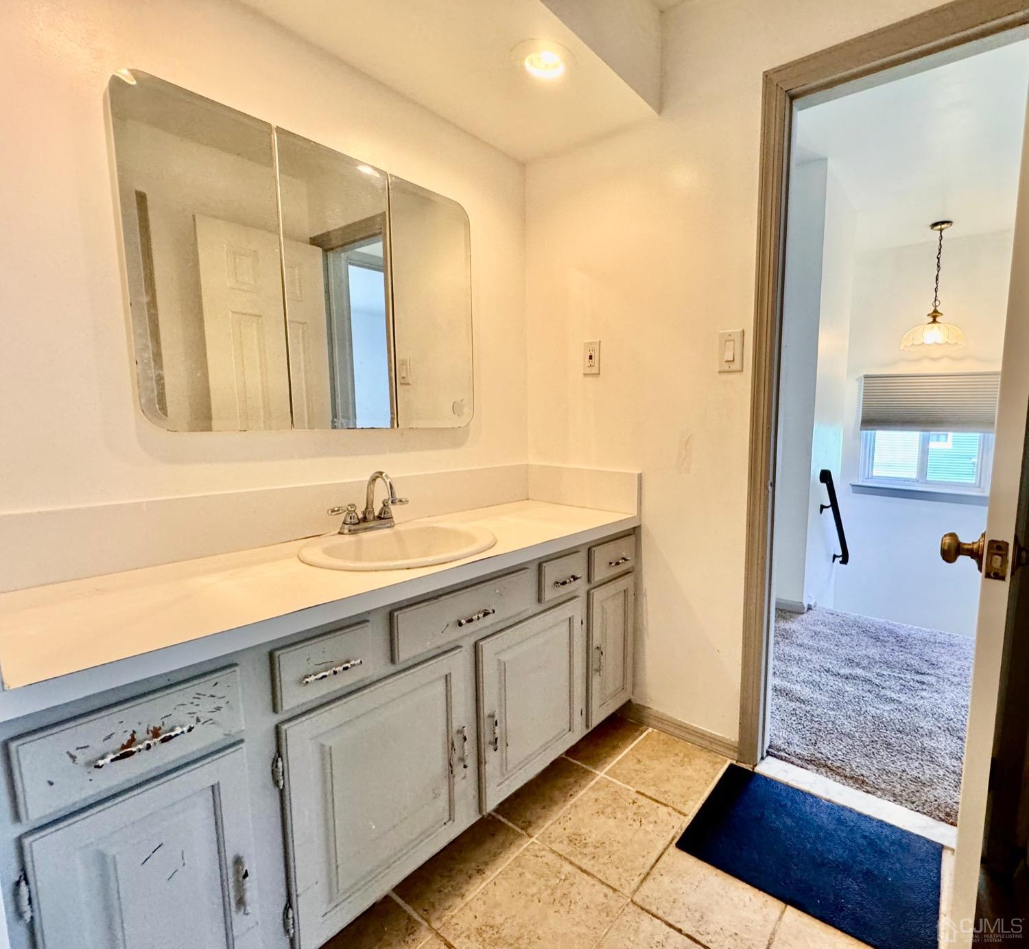 155 Jefferson Boulevard Edison, NJ 08817 - Photo 9 of 21 a spacious bathroom with a sink and a mirror