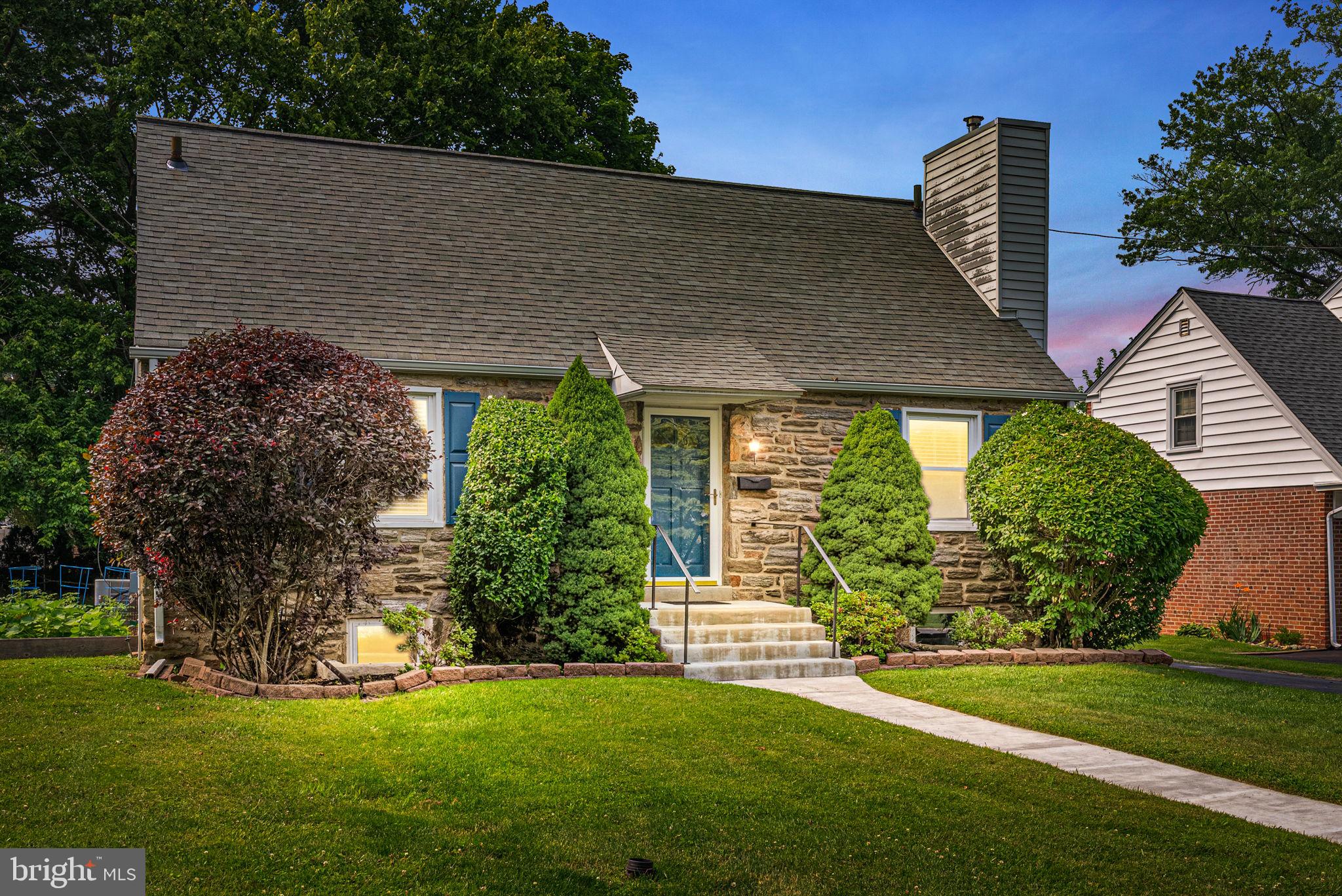116 South Highland Road Springfield, PA 19064 - Photo 1 of 42 a front view of a house with a garden and plants