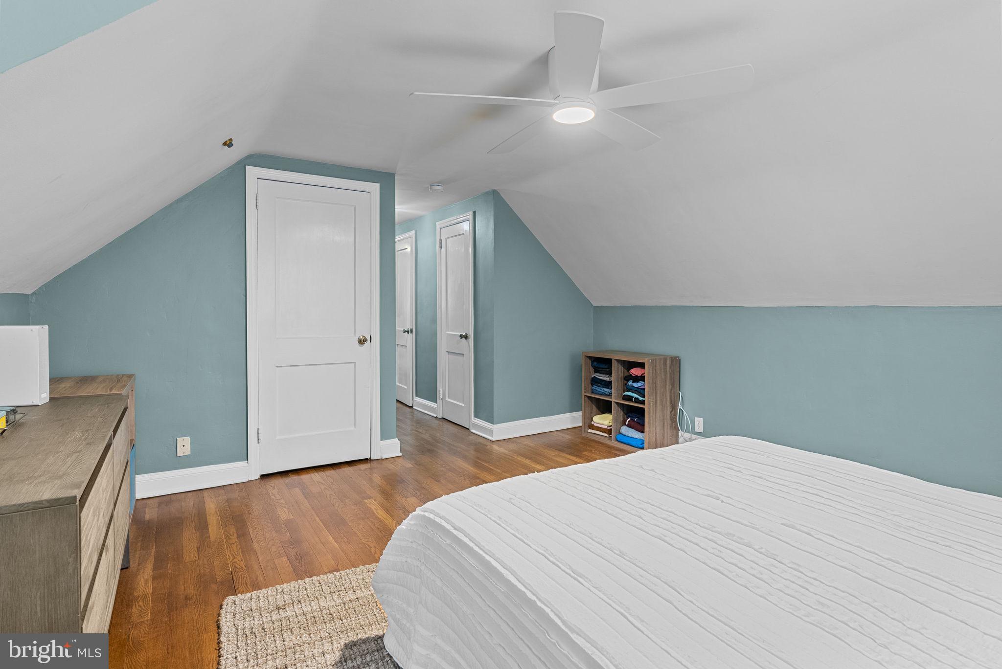 116 South Highland Road Springfield, PA 19064 - Photo 18 of 42 a bedroom with a bed and wooden floor