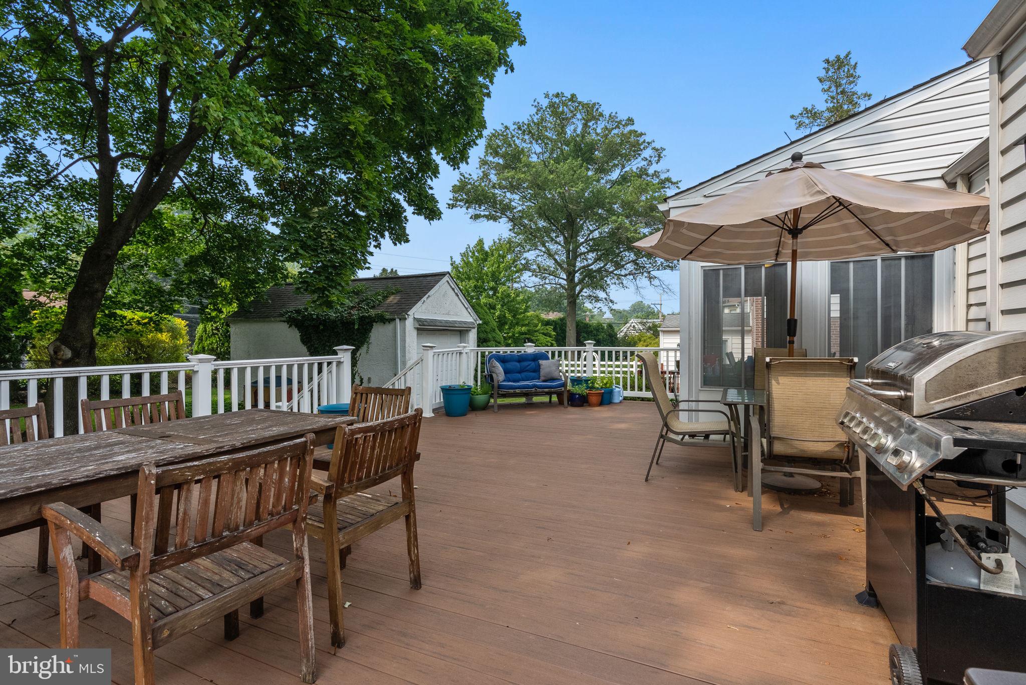 116 South Highland Road Springfield, PA 19064 - Photo 27 of 42 a view of a patio with a table and chairs