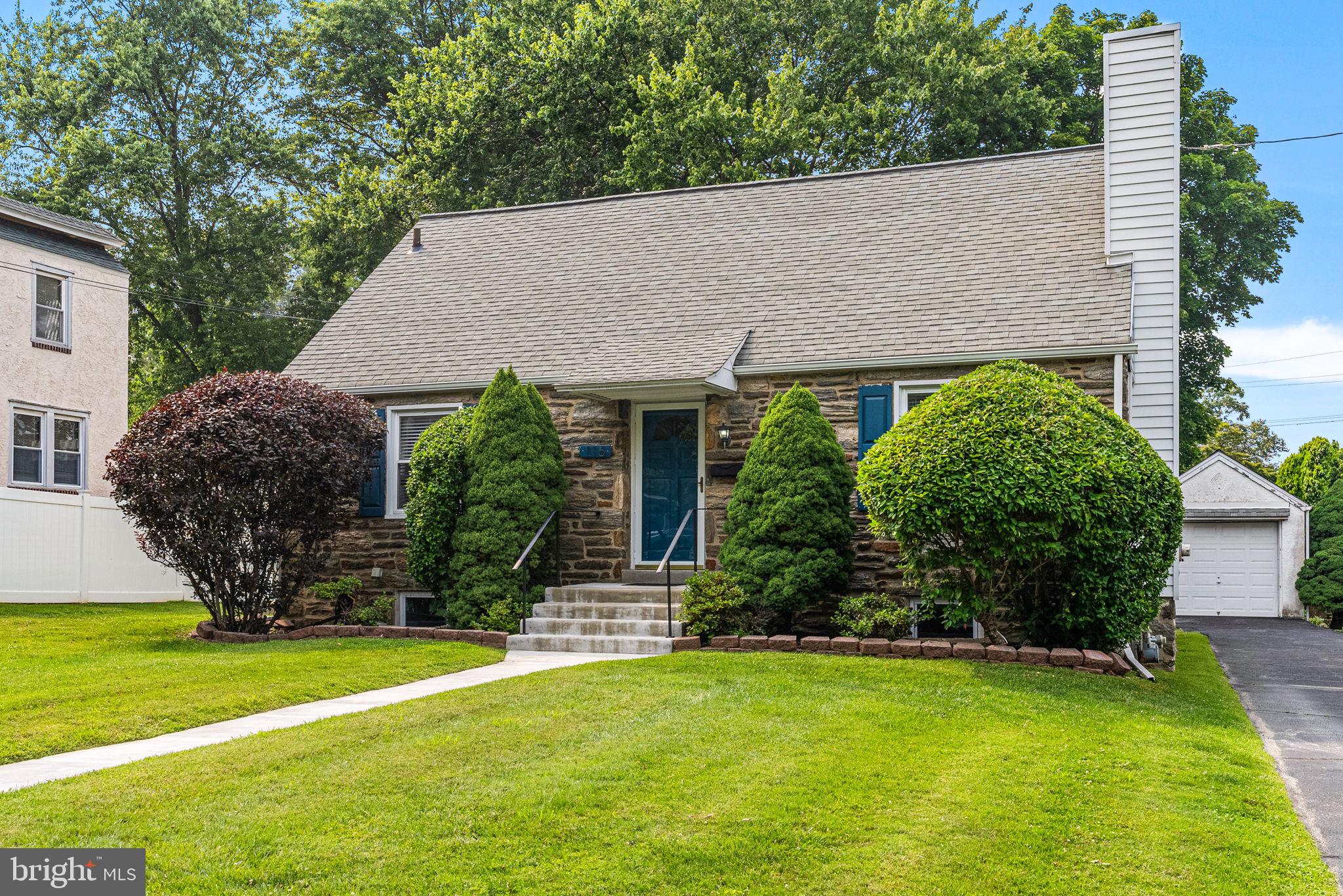 116 South Highland Road Springfield, PA 19064 - Photo 4 of 42 a front view of a house with garden