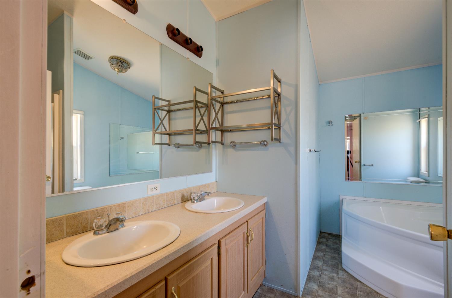 32748 Indian Guide Road Squaw Valley, CA 93675 - Photo 15 of 38 a bathroom with a sink and a mirror