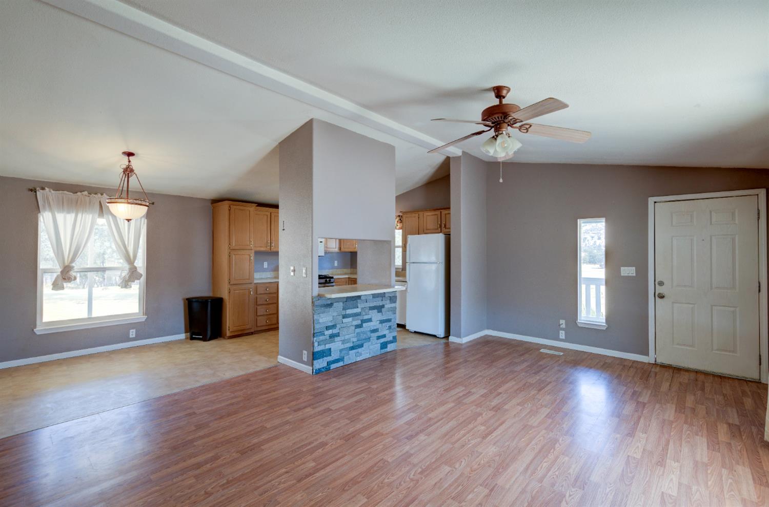 32748 Indian Guide Road Squaw Valley, CA 93675 - Photo 8 of 38 a view of empty room with wooden floor and fan