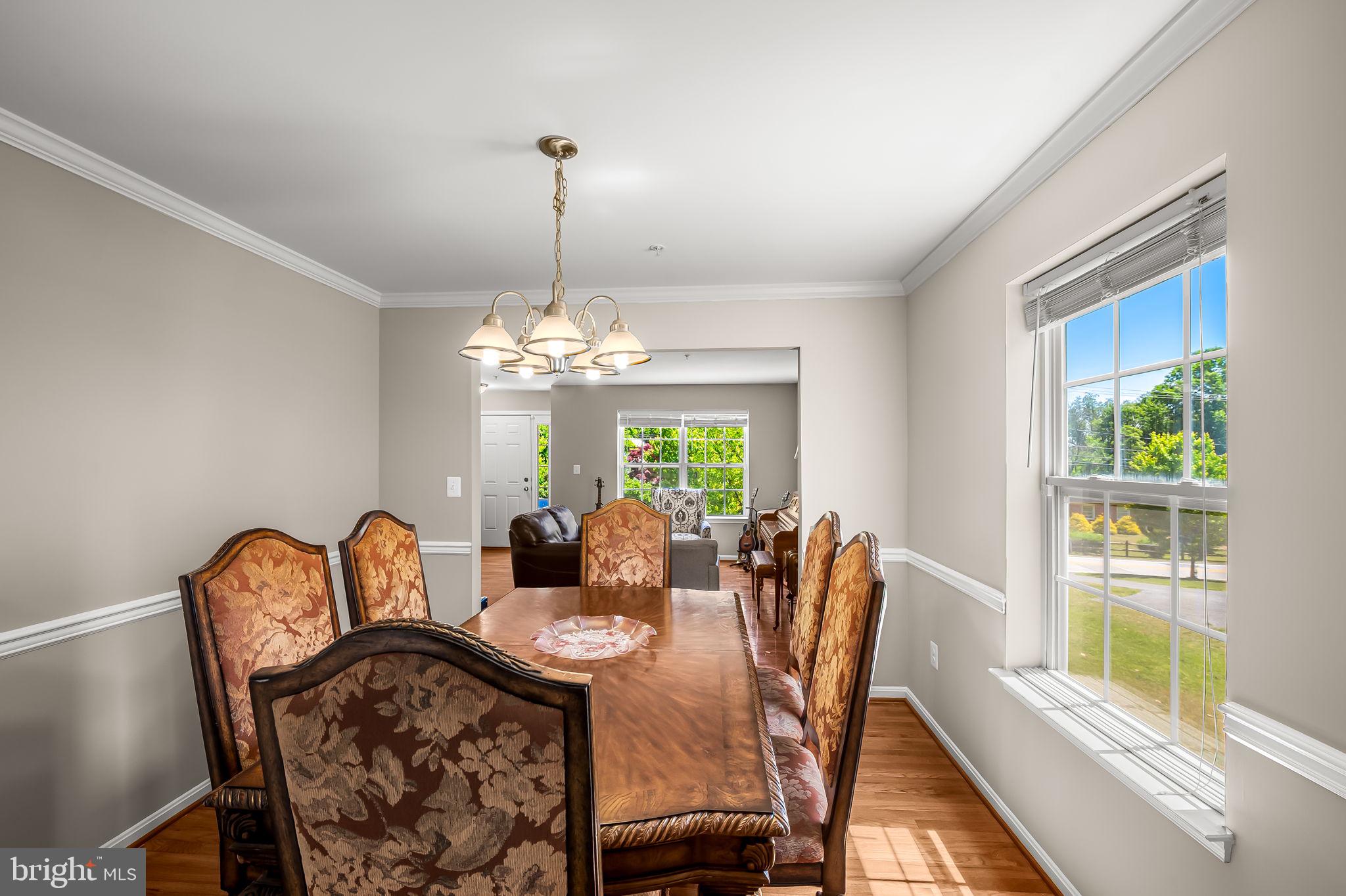 6008 Hanover Road Elkridge, MD 21075 - Photo 6 of 36 a view of a dining room with furniture window and outside view