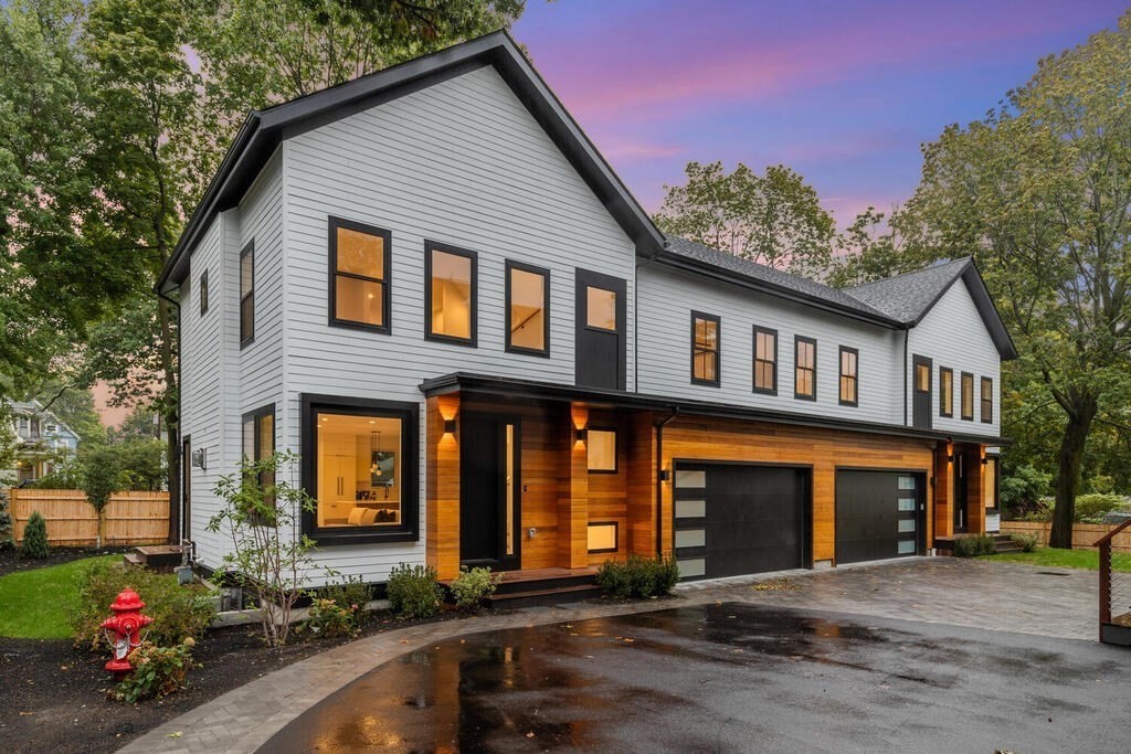 70 Walker Street, Unit 4 Newton, MA 02460 - Photo 1 of 35 a front view of a house with lots of trees around