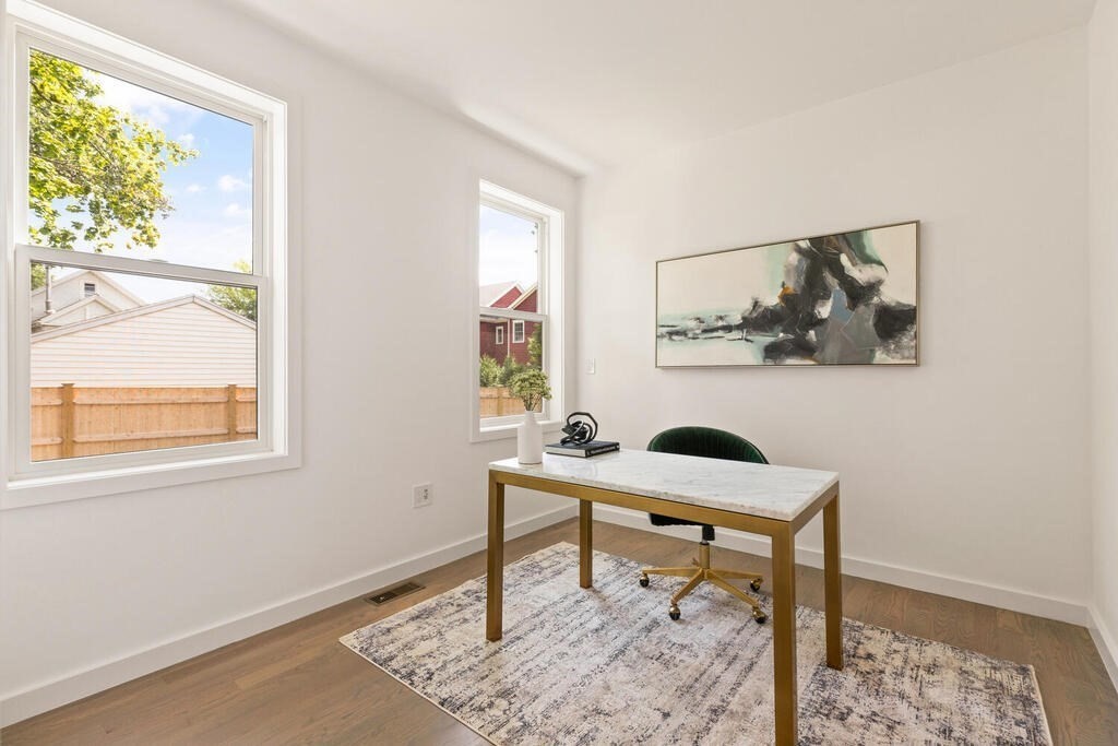 70 Walker Street, Unit 4 Newton, MA 02460 - Photo 11 of 35 a room with furniture and a window