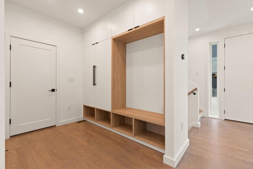 70 Walker Street, Unit 4 Newton, MA 02460 - Photo 12 of 35 a view of an empty room with wooden floor and a window