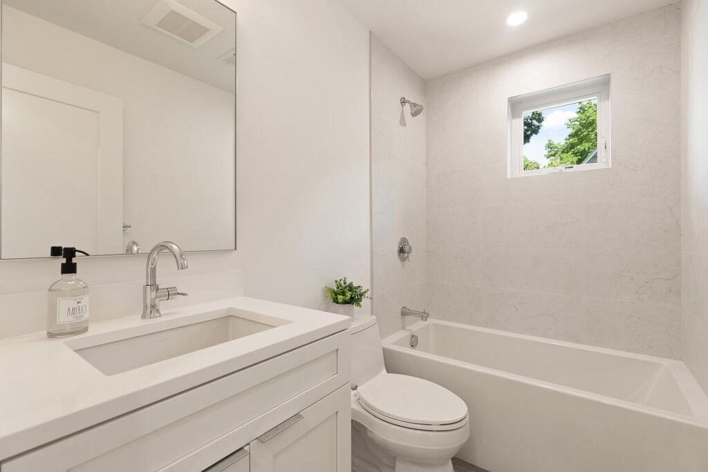 70 Walker Street, Unit 4 Newton, MA 02460 - Photo 22 of 35 a bathroom with a sink a toilet and shower