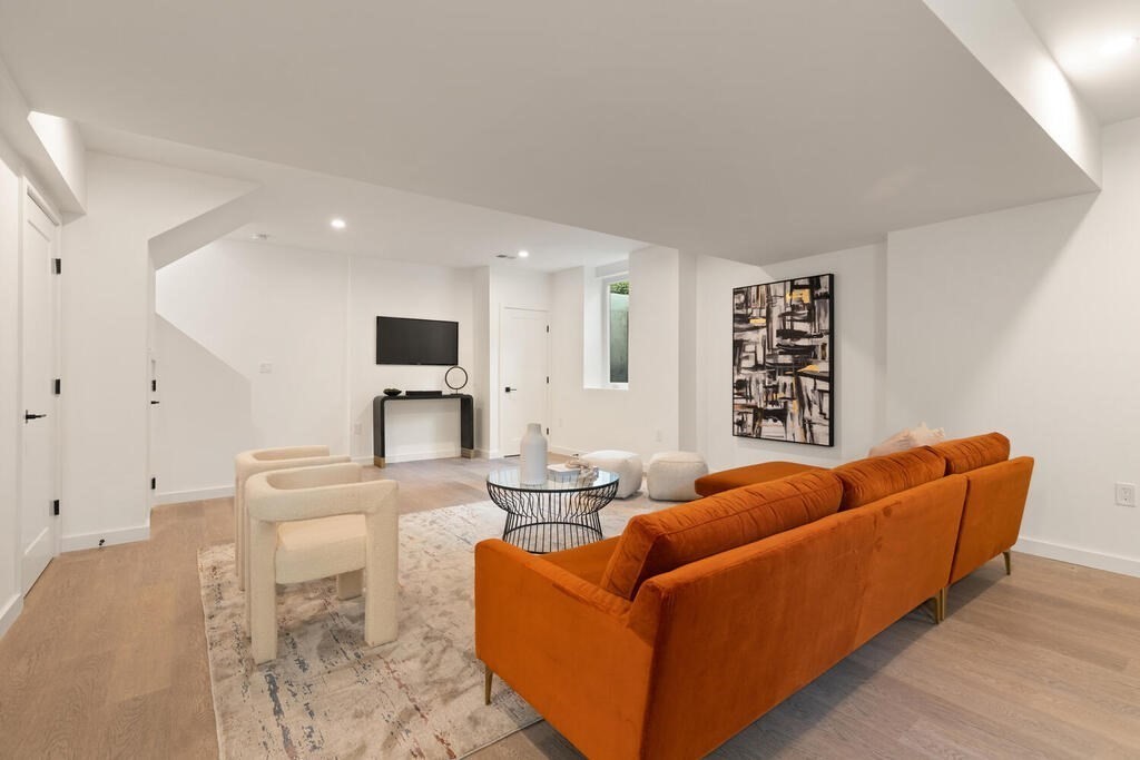 70 Walker Street, Unit 4 Newton, MA 02460 - Photo 24 of 35 a living room with furniture and kitchen view