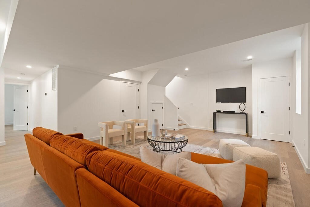 70 Walker Street, Unit 4 Newton, MA 02460 - Photo 25 of 35 a living room with furniture kitchen view and a large window