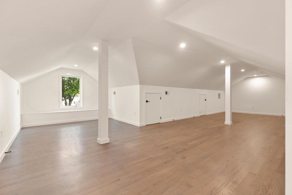 70 Walker Street, Unit 4 Newton, MA 02460 - Photo 28 of 35 an empty room with wooden floor and windows