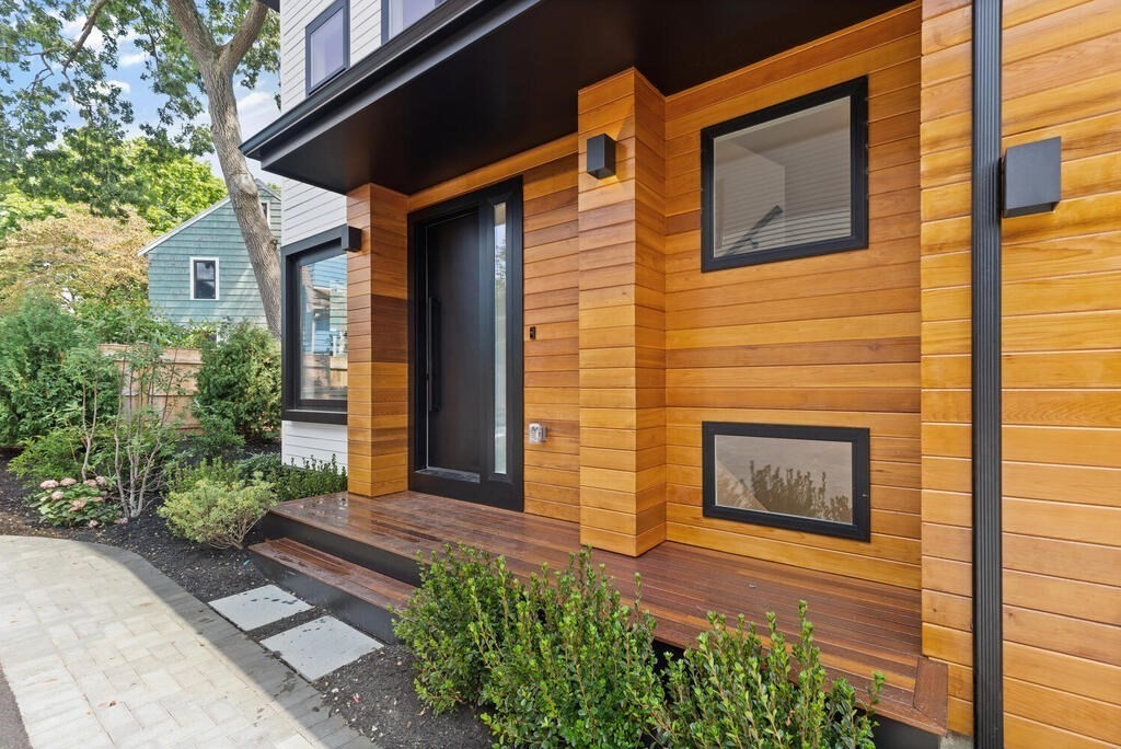 70 Walker Street, Unit 4 Newton, MA 02460 - Photo 31 of 35 a front view of a house with a yard