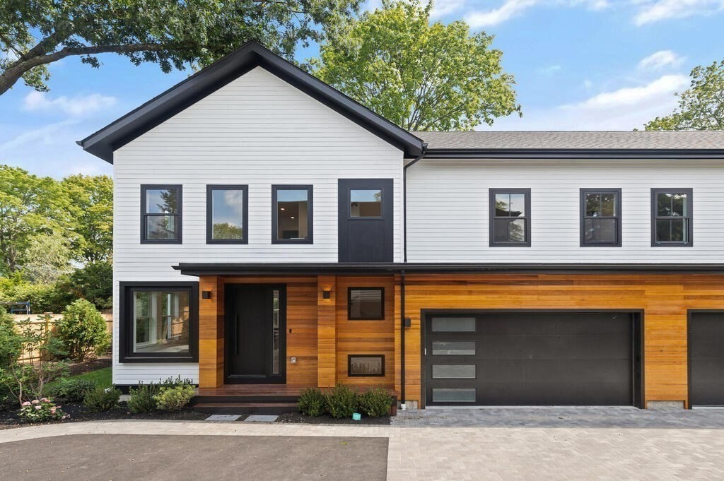 70 Walker Street, Unit 4 Newton, MA 02460 - Photo 33 of 35 a front view of a house with yard