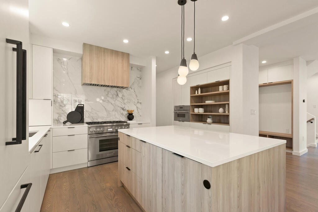 70 Walker Street, Unit 4 Newton, MA 02460 - Photo 7 of 35 a kitchen with stainless steel appliances kitchen island a sink and a stove